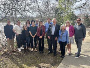 Board members standing by the Sacramento River